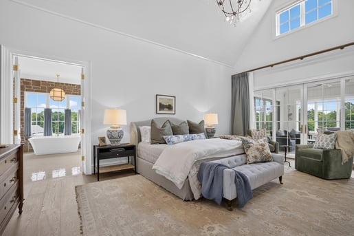Custom primary bedroom and bathroom, lots of natural light, by Wolfe Homes