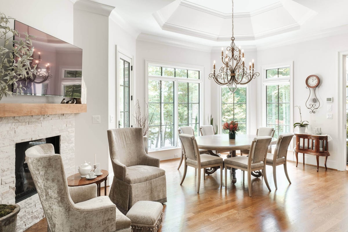 Sunlit dining area with chandelier in a custom home by Wolfe Homes, Greensboro, NC