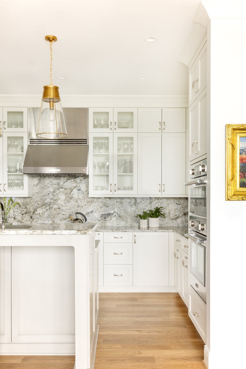 Kitchen with custom backsplash and cabinetry