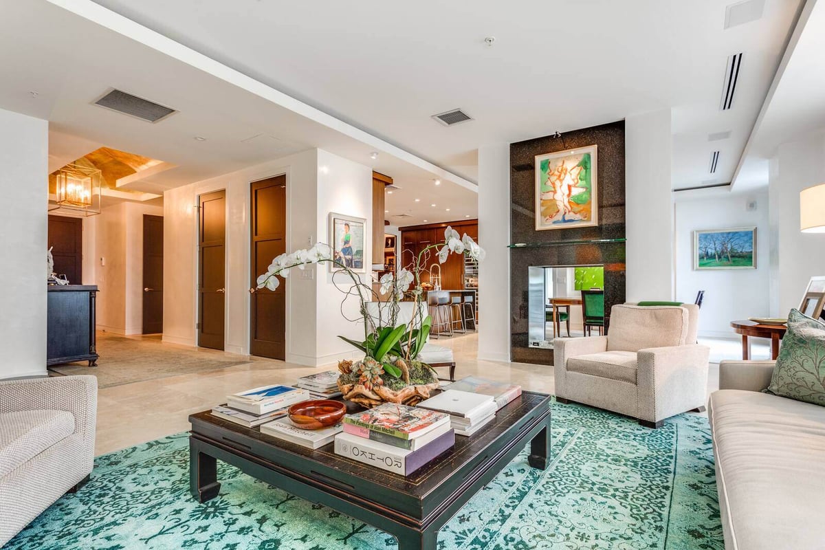 Open-concept living room with cozy seating and contemporary decor in a Wolfe Homes custom home, Greensboro, NC