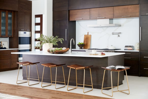 Sleek kitchen design with dark wood cabinets and modern bar seating by Allen & James in Gaston County