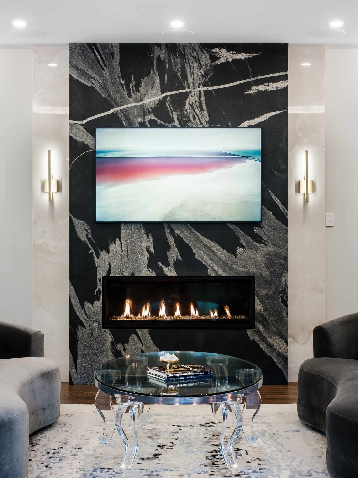 Contemporary fireplace and artwork in a custom living room remodel by Wolfe Homes, Greensboro, NC
