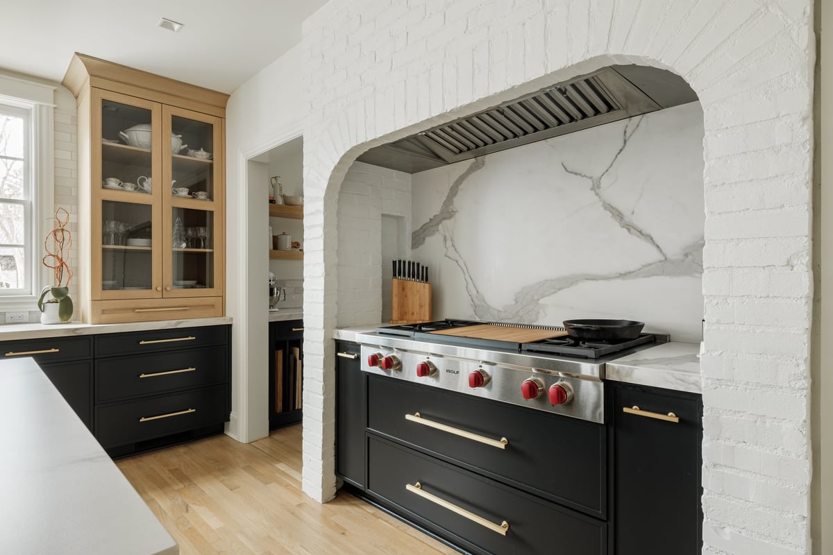 Inset Wolf range with granite backsplash