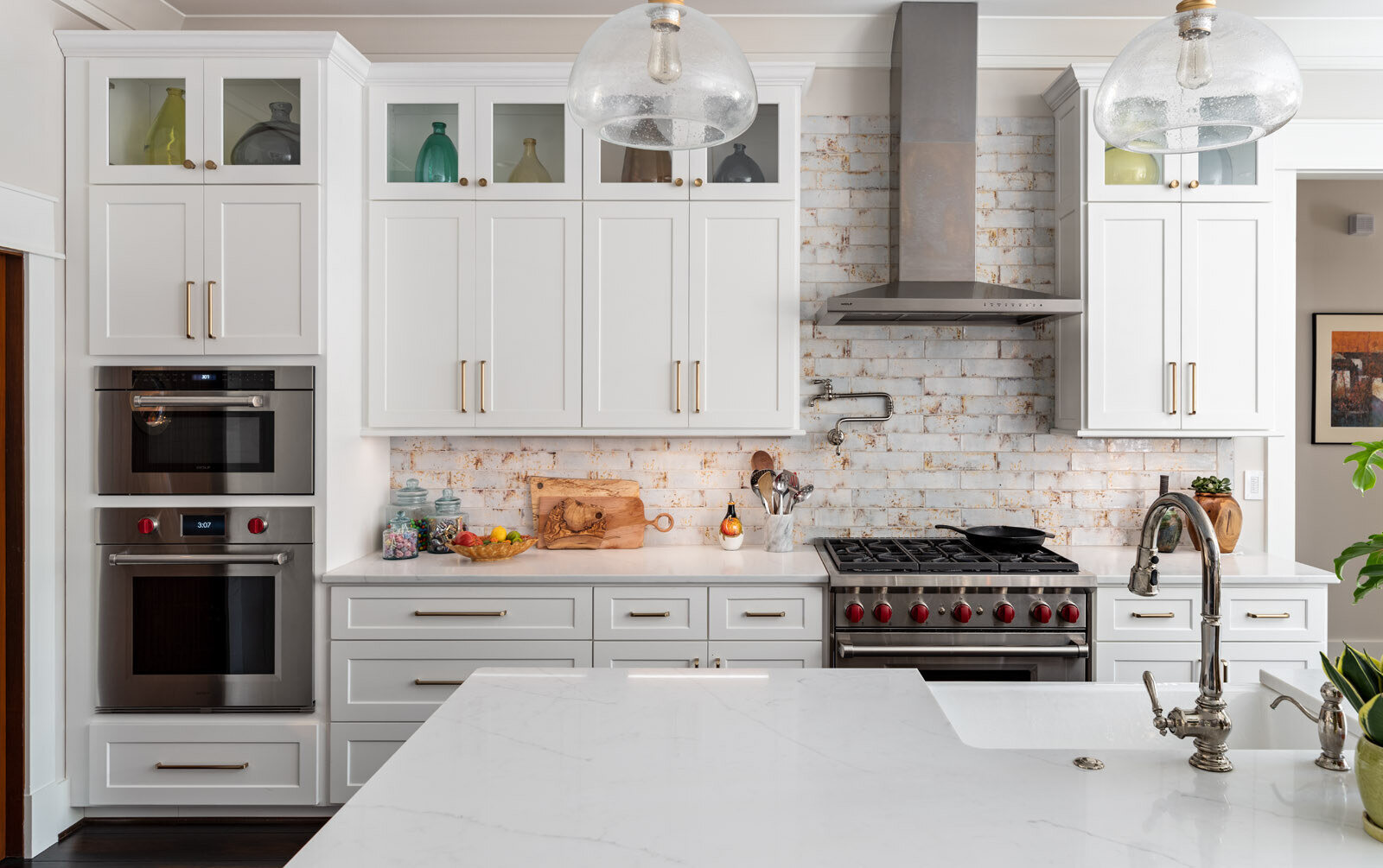 Elegant kitchen remodel by Wolfe Homes in Greensboro, NC, featuring a stylish oven setup and ample storage Elegant kitchen remodel by Wolfe Homes in Greensboro, NC, featuring a stylish oven setup and ample storage