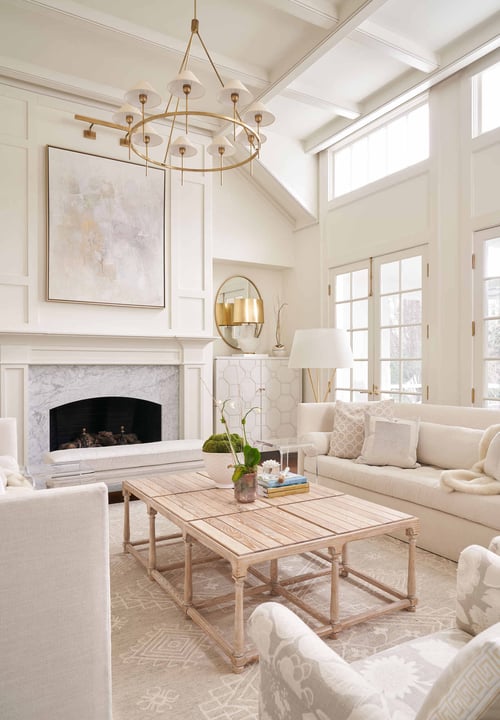 Light and airy living room with large windows and modern decor by Wolfe Homes in Greensboro, NC
