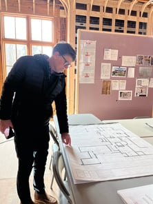 Project Manager reviews plans