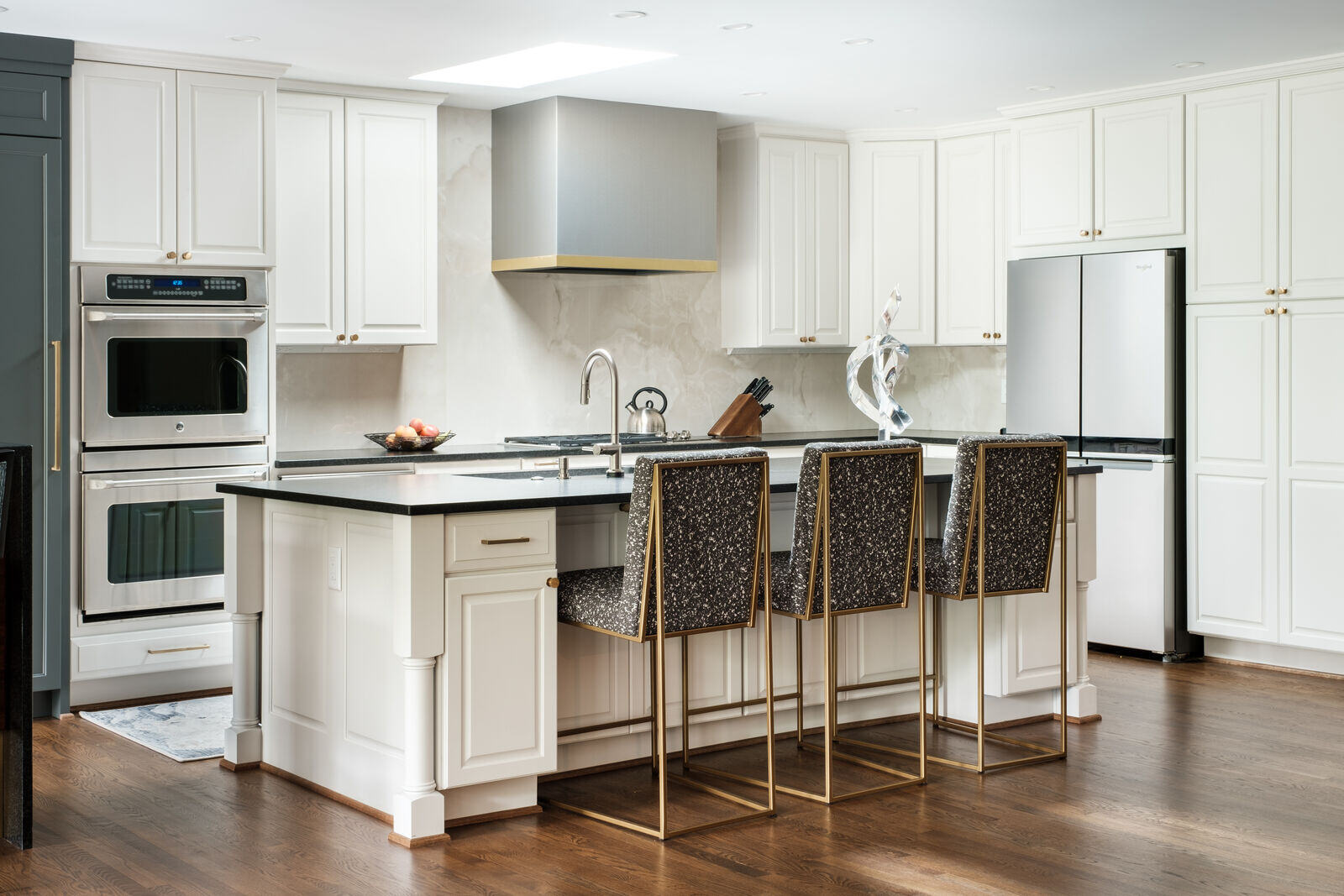 Spacious kitchen remodel with modern white cabinetry by Wolfe Homes, Greensboro, NC