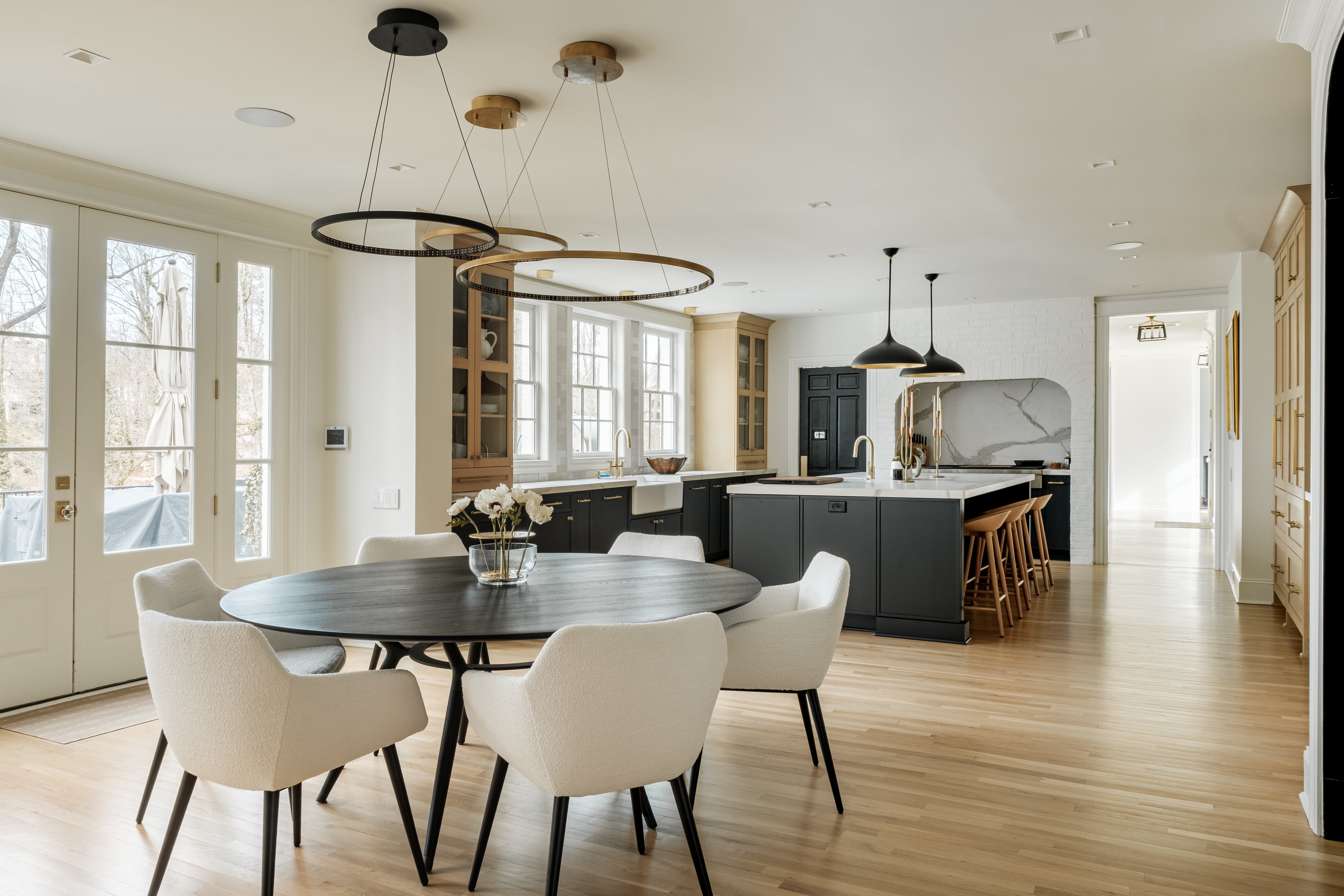 Modern open-concept kitchen and dining area in High Point, NC by Wolfe Homes