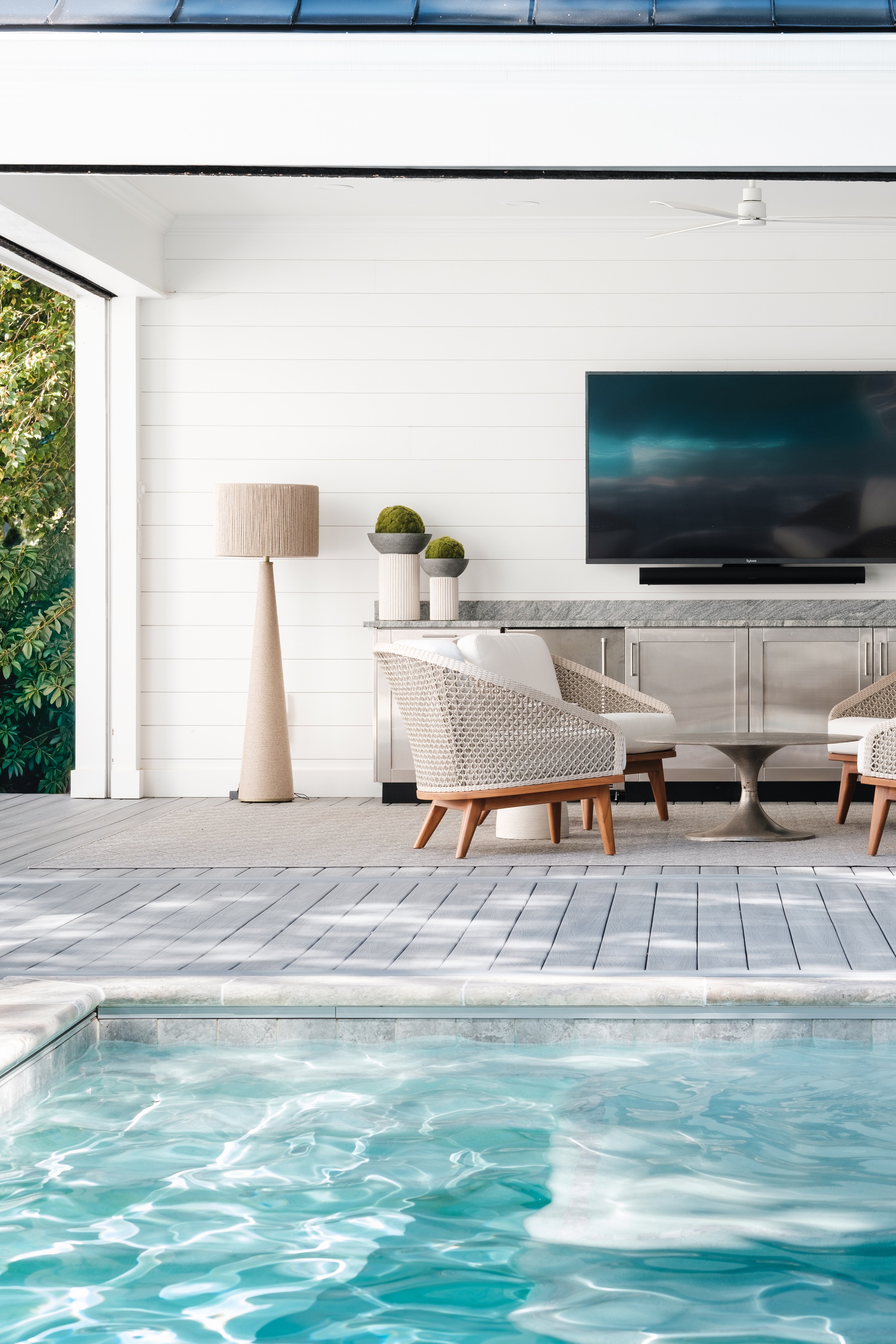 Pool with outdoor living space in Greensboro, NC by Wolfe Homes